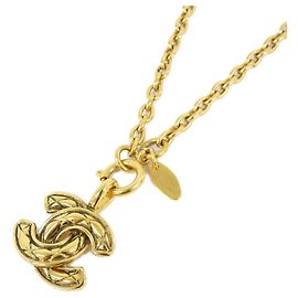 Collier Chanel doré avec pendentif Doré