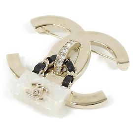 Spilla Chanel ABA011 in pelle nera bianca e oro Nero Bianco D'oro