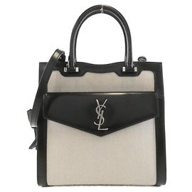Yves Saint Laurent Sac Uptown en toile enduite Saint Laurent Noir
