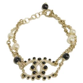 Pulsera Charm Chanel Negro Dorado Crudo