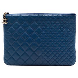 Chanel Blue Medium Bi Quilted Lambskin O Case Clutch Bleu