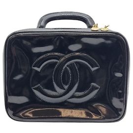 Chanel Bolsa de mão com alça superior e transversal em couro envernizado Preto