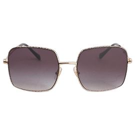 Miu Miu Black and gold square frame sunglasses Black