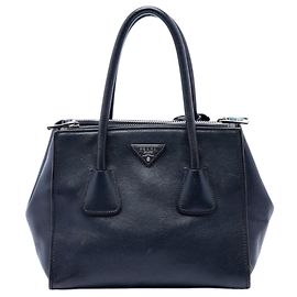 Bolsa satchel azul em couro de vitelo glacê com dois bolsos e alça dupla Prada Azul
