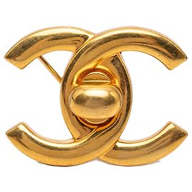 Spilla Chanel CC placcata oro con chiusura Turn Lock D'oro