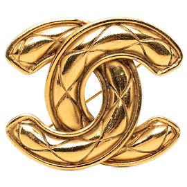 Broche acolchoada Chanel CC banhada a ouro Dourado
