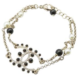 Bracciale Chanel placcato oro CC con perle finte e strass D'oro