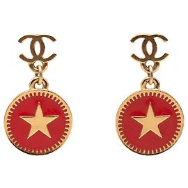 Boucles d'oreilles pendantes avec étoile en émail plaqué or Chanel CC à fermoir poussoir Doré