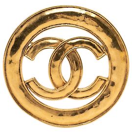 Spilla rotonda traforata Chanel CC placcata oro D'oro