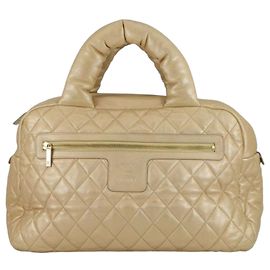 Bolsa Bowler Coco Cocoon em pele de cordeiro metálica acolchoada dourada Chanel Dourado