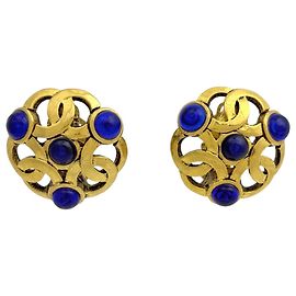 Boucles d'oreilles clips Chanel dorées avec pierre colorée Doré