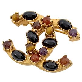 Chanel vergoldete Brosche mit Farbedelstein Andere
