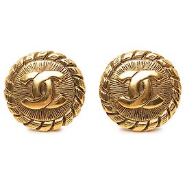 Boucles d'oreilles clips rondes Sunburst Chanel CC plaquées or Doré