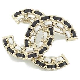 Broche Chanel AB8605 de couro dourado e azul marinho Dourado Azul marinho