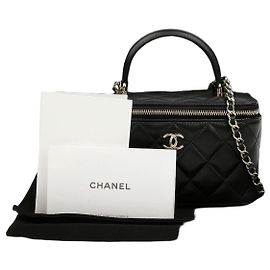 Chanel Borsa Vanity in pelle d'agnello con manico superiore e tracolla a catena Nero Oro Nero