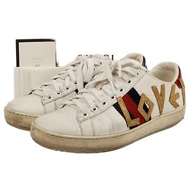 Gucci Sapatilhas Ace em pele branca com bordado Love Branco