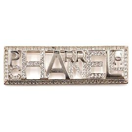 Chanel Broche dourada com logótipo de cristal Multicor