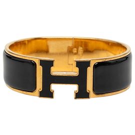 Hermès Pulseira Charm Hermes em Preto e Dourado Preto Dourado