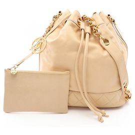 Bolsa de cordão Chanel Coco Charm Bege
