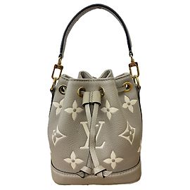 Bolso de hombro Louis Vuitton Monogram Empreinte Nano Noe Beige