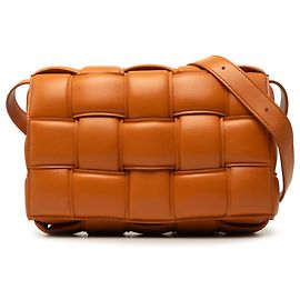 Bottega Veneta Bolsa Tiracolo Cassette acolchoada em Nappa Intrecciato laranja Laranja