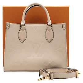 Louis Vuitton Borsa a mano e a tracolla OnTheGo PM Monogram Empreinte Cream Marrone