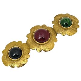 Broche Chanel plaquée or avec pierre colorée Doré