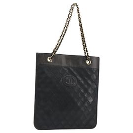 CHANEL Bolsa Tote com corrente em pele de cordeiro preta e dourada CC Outro