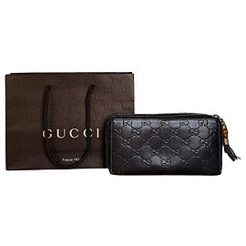 Vintage Gucci GG Embossed Leather Zip Wallet Dark Brown Gold Brown