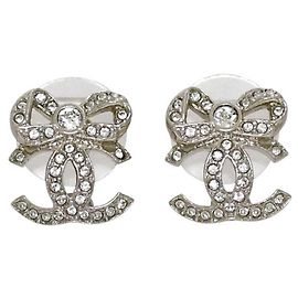 Boucles d'oreilles pendantes Chanel argentées avec strass Argenté