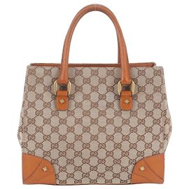 Saco de mão tote Gucci GG Canvas em couro com tachas Marrom