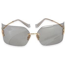 Óculos de sol Aube Miu Miu em metal dourado e lentes cinzas Outro