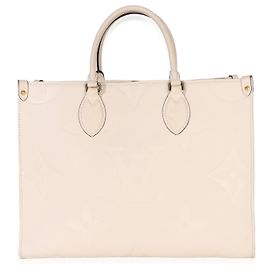 Louis Vuitton Creme Giant Monogram Empreinte Onthego MM Beige