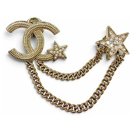 Broche Chanel em metal dourado Coco Mark Star com corrente e strass Dourado