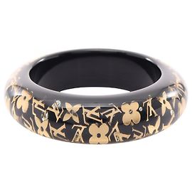 Bangles Louis Vuitton in resina nera e oro Nero D'oro