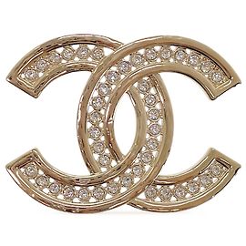 Broche Chanel Gold CC plaquée or avec strass Doré