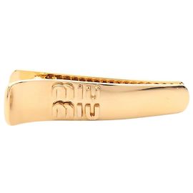Fermi capelli Miu Miu placcati in oro D'oro