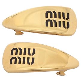 Fermi capelli Miu Miu placcati in oro D'oro