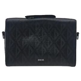 Christian Dior The Dior house's sophisticated Lingot bag line's distinctive rectangular tab detailing harmonizes with luxurious leather material for a sophisticated mood. Its practical case silhouette allows Black