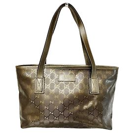 Saco Tote em couro com estampa GG Gucci Dourado