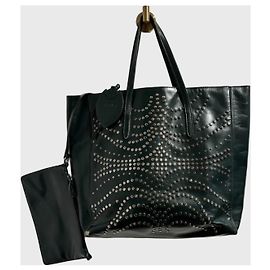Borsa tote Alaïa in pelle verde con borchie metalliche Verde