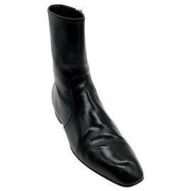 Bottines Colt en cuir verni noir Khaite Noir