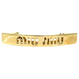 Fermi capelli Miu Miu in metallo dorato D'oro