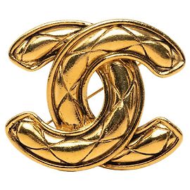 Broche matelassée Chanel CC plaquée or Doré