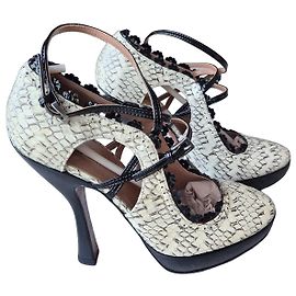Escarpins Alaïa en cuir de python Noir Beige