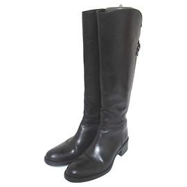Autre Marque Botas longas de couro com tiras cruzadas Sartore Preto