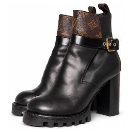 Louis Vuitton, botines con hebilla star trail Castaño Negro