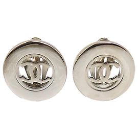 Boucles d'oreilles clips rondes en laiton Chanel CC argentées Argenté