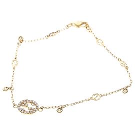Gucci Interlocking Armband mit Anhängern aus 18K Gelbgold Golden