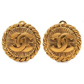 Boucles d'oreilles clips rondes Sunburst Chanel Gold CC plaquées or Doré